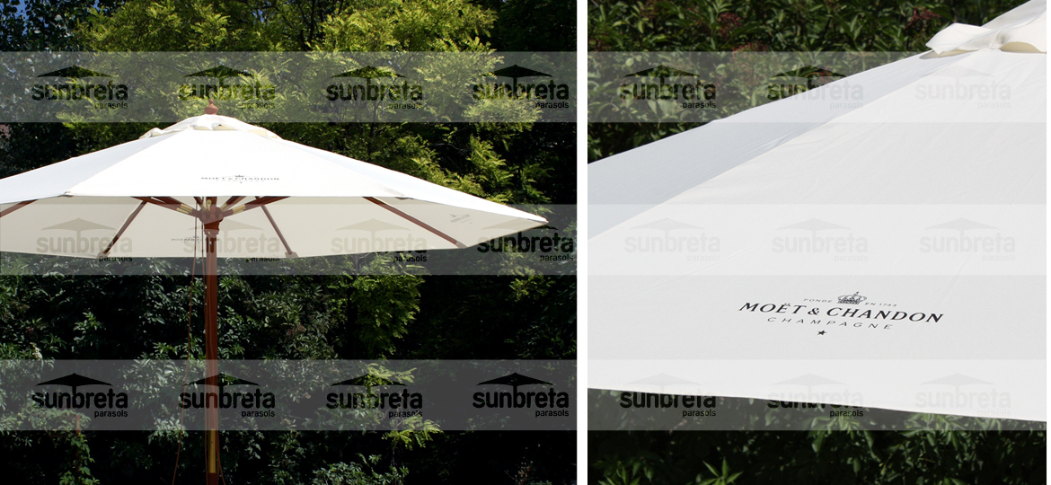 Detalle de un parasol blanco personalizado para una marca de hospitality